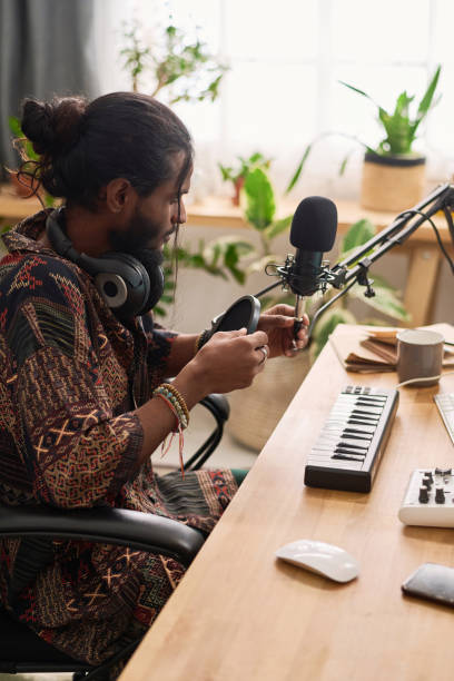 istock Man fixing sound recording equipment 2150358452