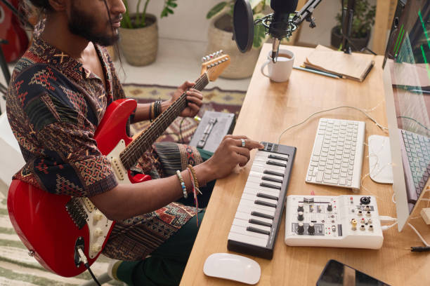 istock Musician adjusting sounds of synthesizer 2150358454