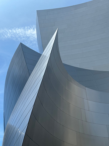 Low-angle close-up of geometric glass sections of the distinctive Walt Disney Concert Hall in Los Angeles