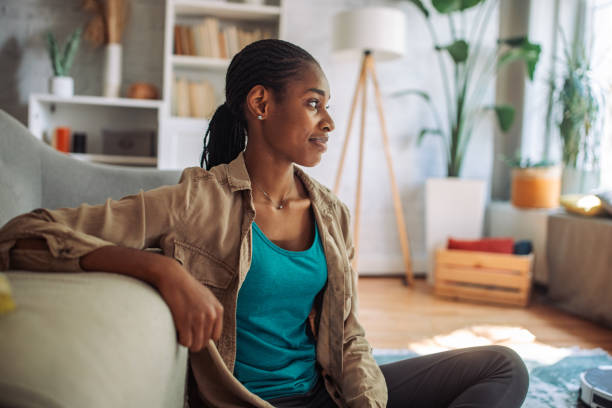 istock Casual young woman in home interior 2150360248