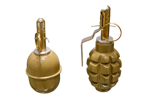 A mock-up grenade used for training soldiers on handling and throwing explosive weapons, isolated on white background.