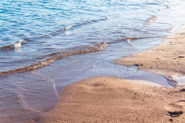 istock Soft wave of the sea on the sandy beach. 2150361796