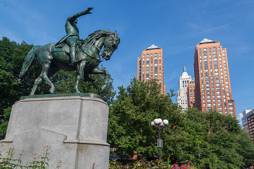 The brick Zeckendorf Towers in Union Square, Manhattan Island, New York City and the statue of Horseback riding George Washington