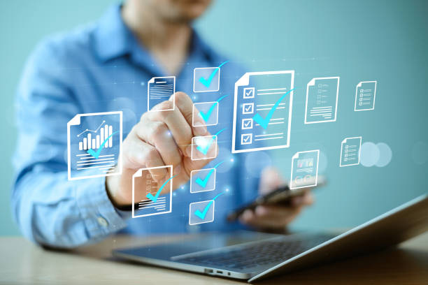 istock Document management system concept. Business performance evaluate checklist review. Businessman check electronic document on digital virtual screen, computer online checklist survey, fillÂ assessment 2150364154