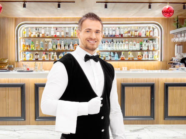 istock Professional waiter with a towel around his arm 2150364791