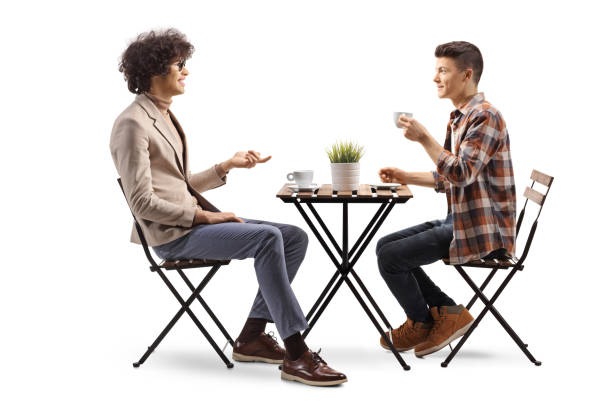 istock Guys in a cafe sitting and talking 2150364811