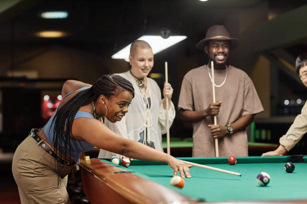 istock Smiling Black Woman Playing Pool 2150365263