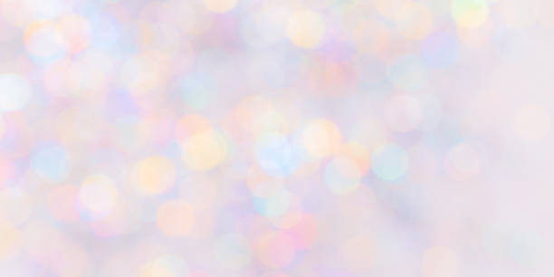 istock Defocused abstract bokeh background pastel colored, flare from lights, color gradient, blurred circle bokeh as holiday texture. Glittering aesthetic textured lighting pattern 2150365393