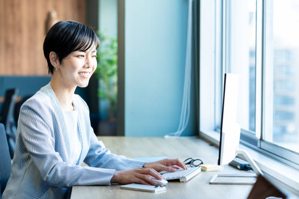 istock business woman working in the office 2150365702