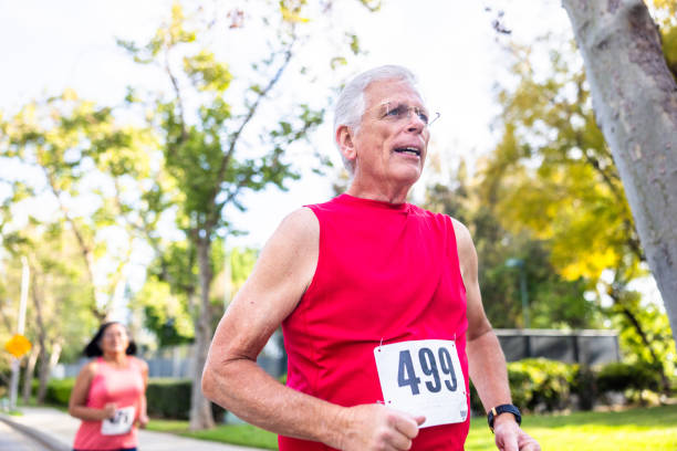 istock Senior man running in a marathon race 2150367801