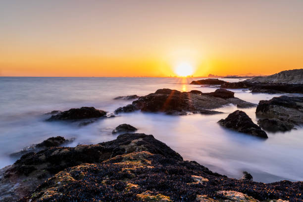 istock sunset by the sea 2150369052