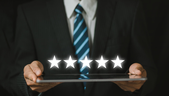 Customer evaluation feedback. men in suit Giving Positive Review for Client's Satisfaction Surveys. giving a five star rating. Service rating, satisfaction concept.