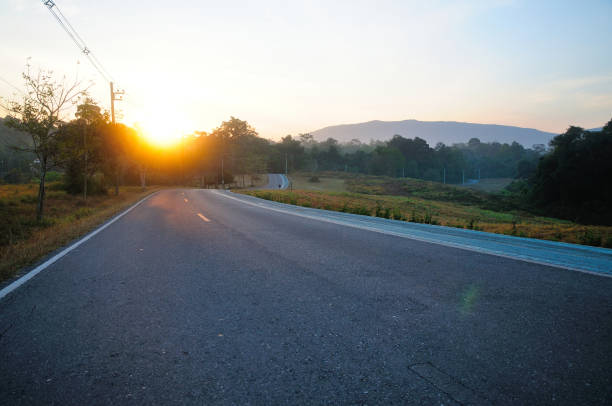 istock A Long Curvy Road in the Mountain at Sunrise 2150372004