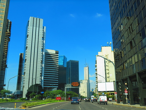 Buenos Aires, Argentina - The Leandro N. Alem Avenue (Avenida Leandro N. Alem) with cars and buildings. Buenos Aires cityscape. Puerto Madero in Buenos Aires city.