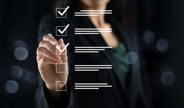 istock Businessman ticking correct marks for document approval, project acceptance and quality assurance concept, doing assessment, checklist, questionnaire, evaluation, online survey, online exam. 2150374167