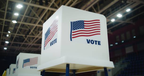 istock Voting booth with American flag logo at polling station 2150380153