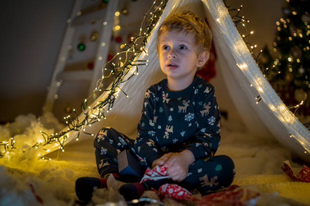 istock Happy boy playing at home in a tent 2150380440