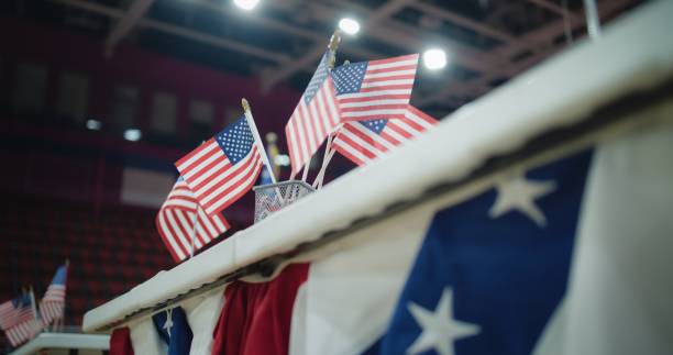 Close up of table with American flags standing at polling place