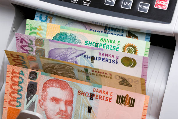 istock Albanian lek in a counting machine 2150385027