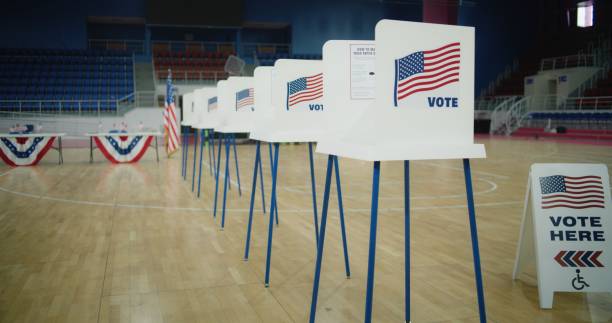 istock Voting booths with American flag logo at polling station 2150386209