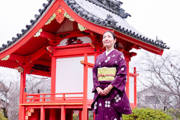istock Young beautiful woman visiting  temple 2150386232