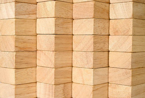 Block of woods. Background of beautifully stacked wooden planks.