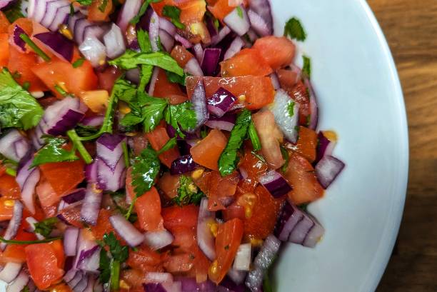 istock Closeup of tomato and onion salsa 2150387148