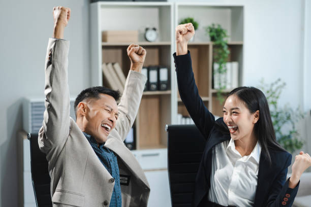 istock Happy smiling businessman feel happy work complete Teamwork success, success at work in the office concept. 2150387520