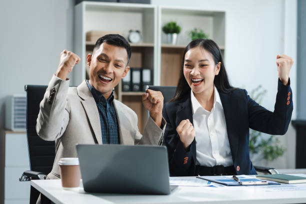istock Happy smiling businessman feel happy work complete Teamwork success, success at work in the office concept. 2150387530