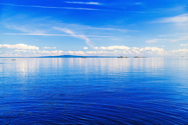 Waterscape view at a coast with a hill in the summer