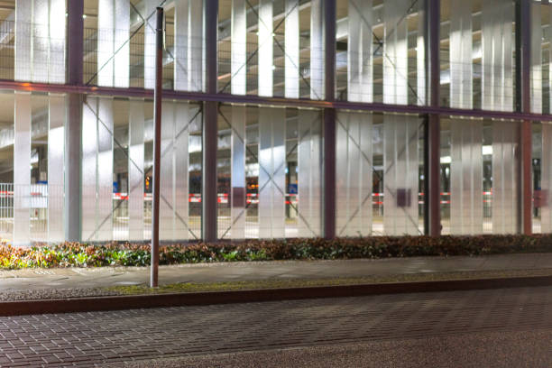 A modern parking garage at night in Berlin. The modern architecture is particularly impressive at night.