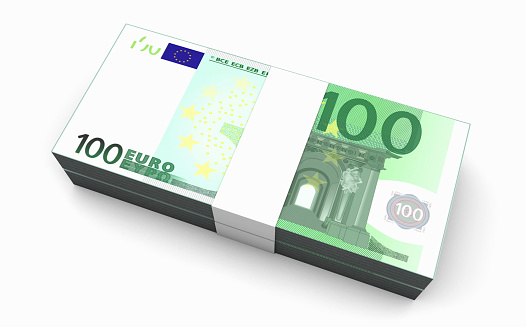One hundred euro money laid out on black. Business and financial background. Space for text.