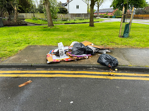 Fly tipping on the pavement by a park, in Walthamstow, East London. April 2024