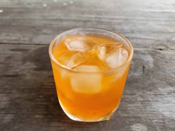 istock Orange soft drink and ice cubes 2150392273