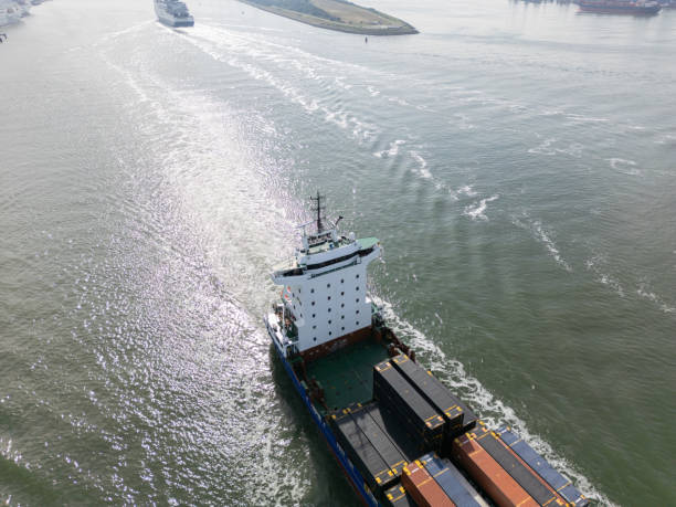istock Drone shot of cargo ship transporting containers 2150393090