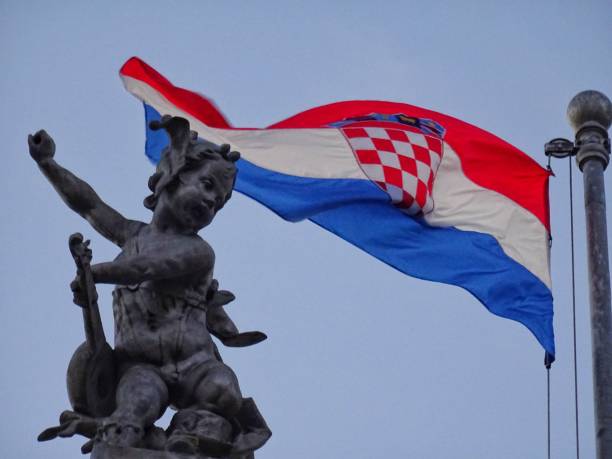 istock Croatian flag with a statue of victory 2150393548