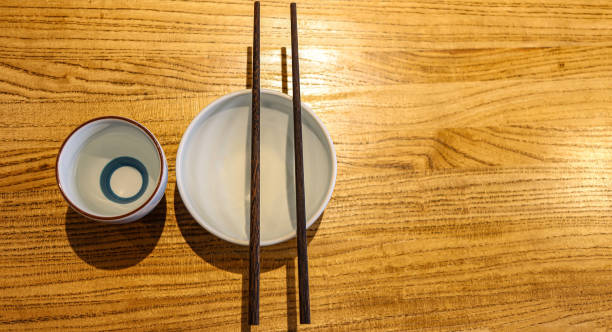 istock Chopsticks and plates for eating Asian food. Space for text. 2150394058