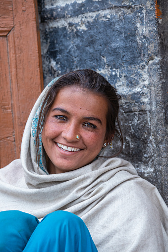 Leh, India - june 24, 2015 : Indian happy girl on the street market in mountain village Leh, Ladakh region, north India, close up