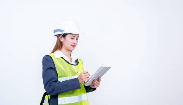 istock Happy woman engineer worker working with digital tablet on white background. 2150394432