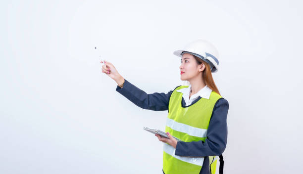 istock Happy woman engineer worker working with digital tablet on white background. 2150394433