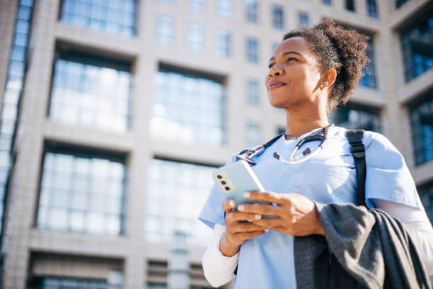 istock A female doctor is using a smartphone. 2150395642