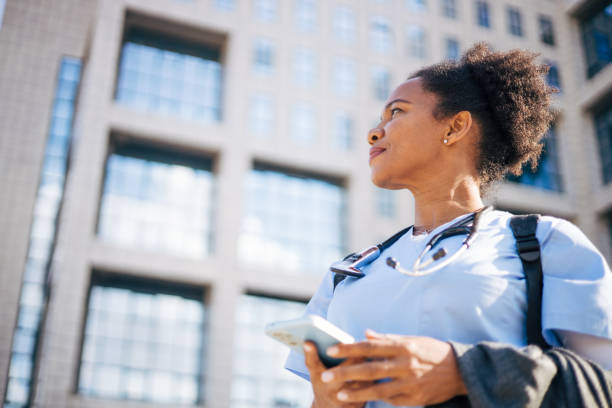 istock A female doctor is using a smartphone. 2150395685
