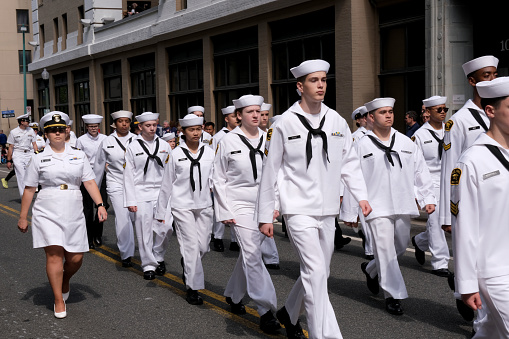 Norfolk, Virginia; USA:  April 20th 2024:  At the annual 75th anniversary of the NATO parade in Norfolk Virginia teenaged military cadets march along the streets in Norfolk, Virginia.