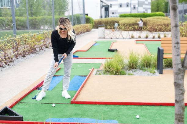 istock Woman playing mini golf at course. Summer sport and leisure activity 2150395969