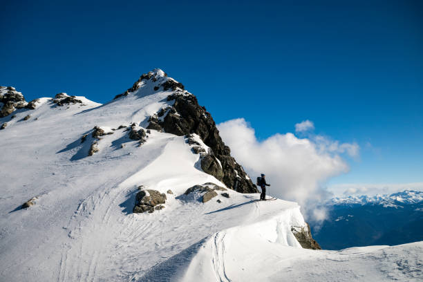 istock Mature backcountry skier ascends mountain 2150396253