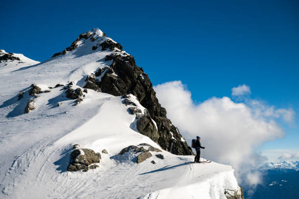 istock Mature backcountry skier ascends mountain 2150396308