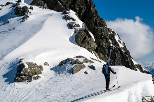 istock Mature backcountry skier ascends mountain 2150396309