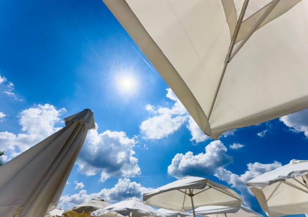 Sun umbrellas against blue sky