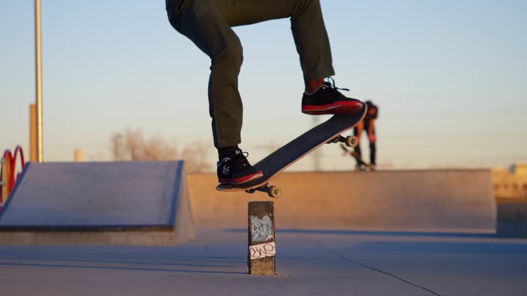 Man does a grind on their skateboard