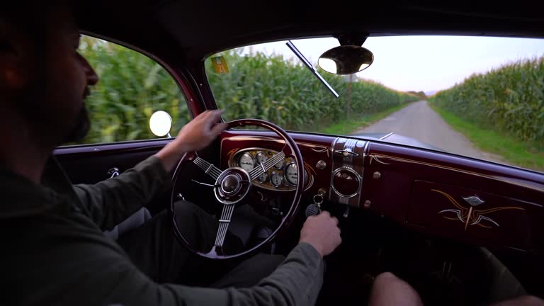 A classic car filmed from the inside while driving.